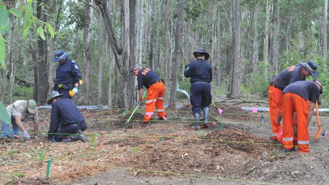 Police and SES crews conduct a search in March at the Goomboorian property where Bruce Saunders died in a woodchipper last year.