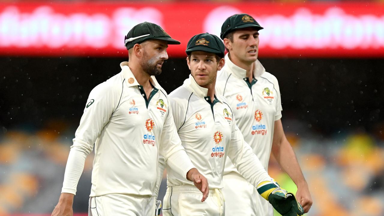 Tim Paine, Nathan Lyon and Pat Cummins of Australia.