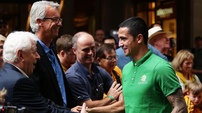 Tim Cahill with Frank Lowy and David Gallop at the Socceroos’ celebrations.