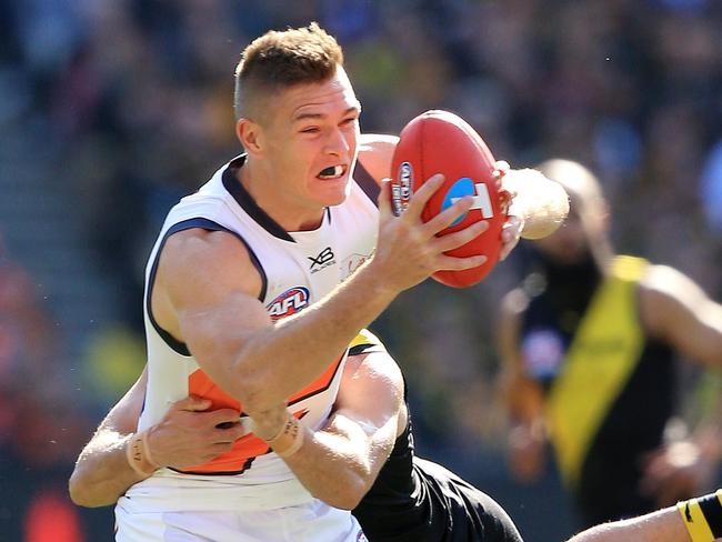 Adam Tomlinson of the Giants under pressure from during the 2019 AFL Grand Final match between the Richmond Tigers and the GWS Giants at the MCG on September 28, 2019 in Melbourne, Australia. Picture: Mark Stewart