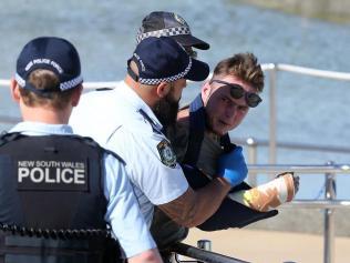 Bondi Beach cop spitter claims to have coronavirus