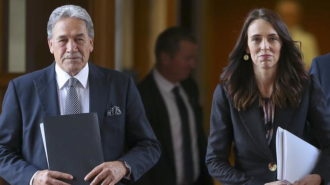 Jacinda Ardern enters parliament in Wellington with Deputy Prime Minister Winston Peters on Thursday. Picture: AP