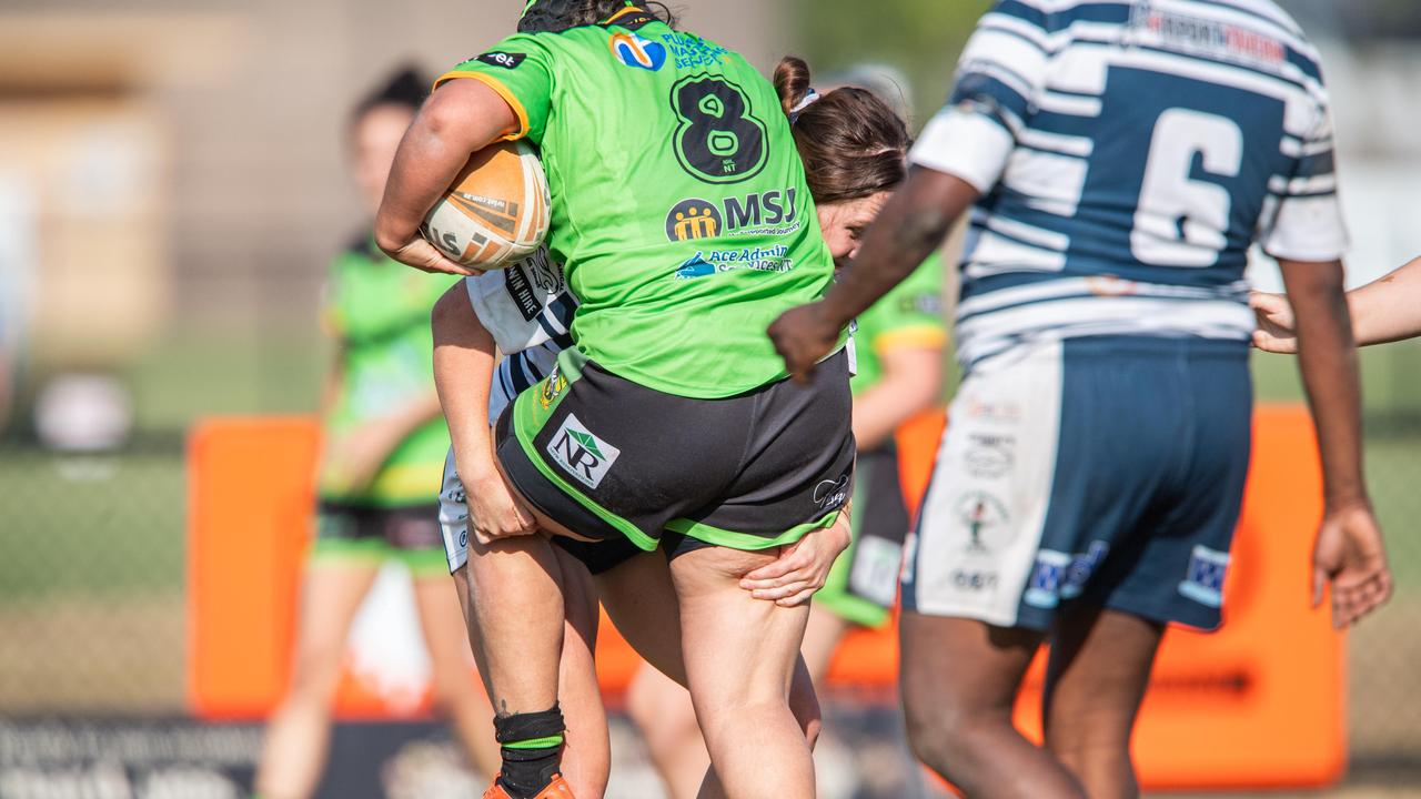 Jacinda Summers tackles Davina Issac 8 as the Darwin Brothers take on the Palmerston Raiders in the NRL NT semi final. Picture: Pema Tamang Pakhrin