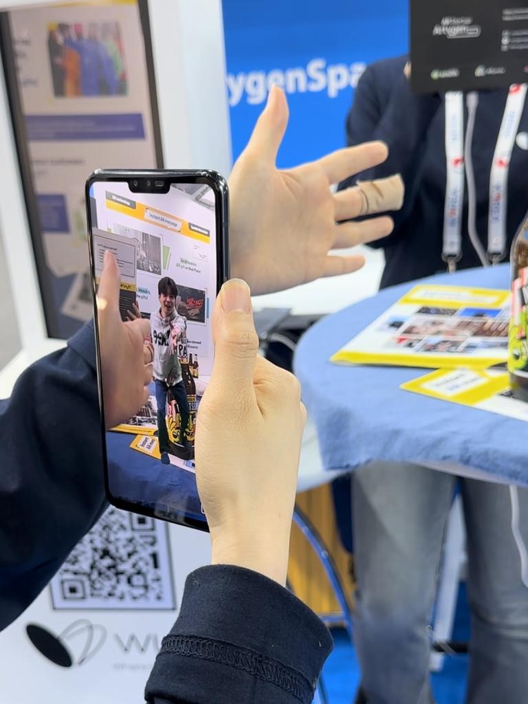 Artygen displays a type of AR that allows a user to play games with an image via a mobile app called WYFT.