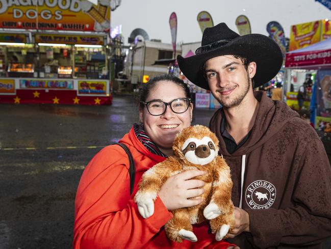 Marishka Wight and Mikie Cameron with a soft toy won in a shooting game at sideshow alley at Toowoomba Royal Show, Saturday, April 20, 2024. Picture: Kevin Farmer