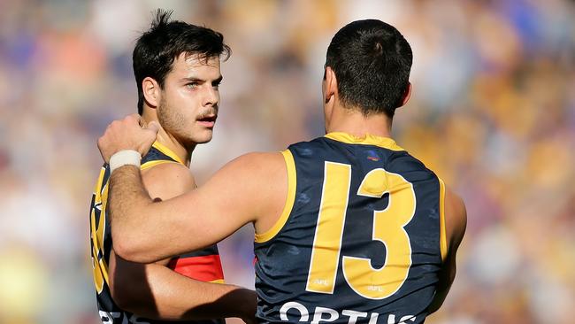 Co-captain Taylor Walker congratulates Darcy Fogarty on one of his five goals for the Crows in Perth. Picture: Will Russell/AFL Photos via Getty Images