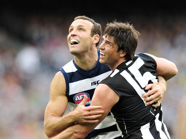 Immanuel old scholar Brad Ottens (left) battles for Geelong in the ruck in the 2011 AFL grand final.