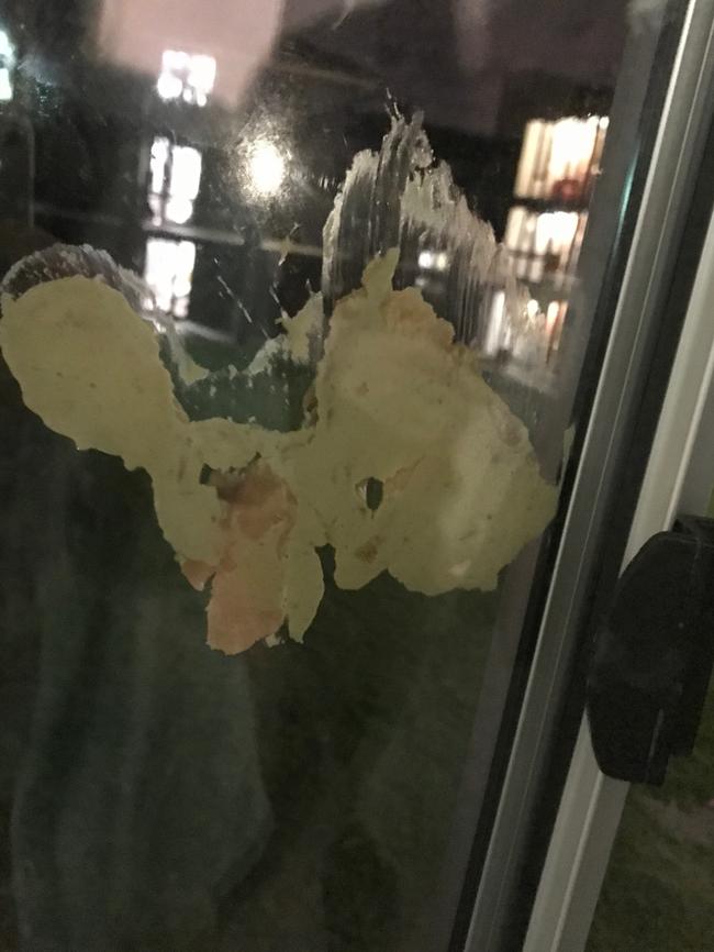 Raw chicken was smeared on Melis Layik's window.