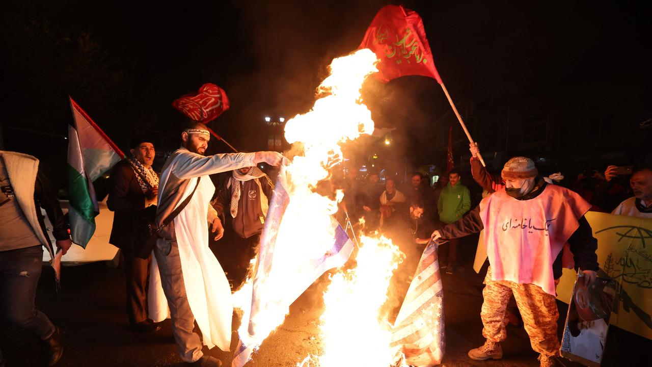 Iranian protesters in Tehran burn an Israeli and a US flag during a demonstration with Iran-backed Yemeni rebels. Picture: AFP