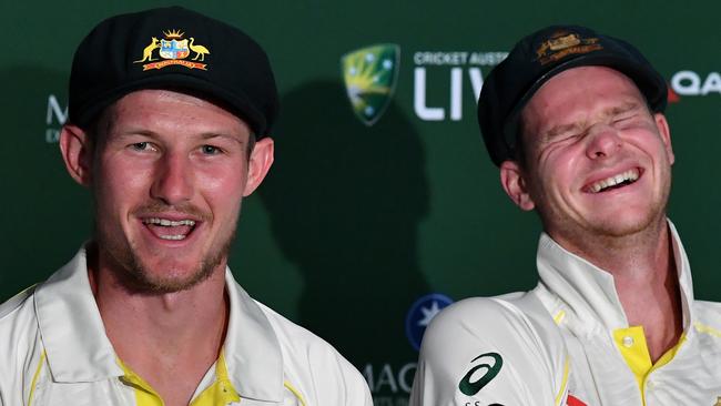 Cameron Bancroft (left) and Steve Smith talk about headbutting. Photo: AAP