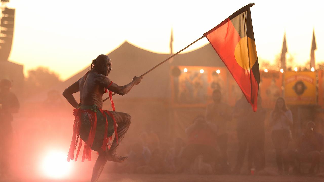 An Aboriginal traditional dancer with the Aboriginal flag, performing at the Gulf Country Frontier Music Festival in Gregory Downs, Qld in 2018. Picture: Lyndon Mechielsen