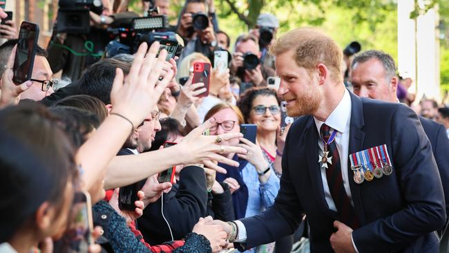 Prince Harry greets the public while departing The Invictus Games Foundation 10th Anniversary Service at St Paul's Cathedral in London. Picture: Getty Images