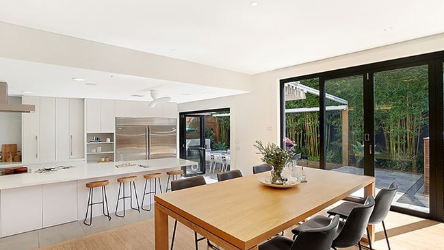 An open plan kitchen and dining area leads out onto a terrace in the Malabar home chef Pete Evans has sold for $2.76 million. Picture: realestate.com.au