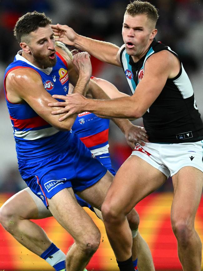 Marcus Bontempelli and Dan Houston clash. Picture: Quinn Rooney/Getty Images