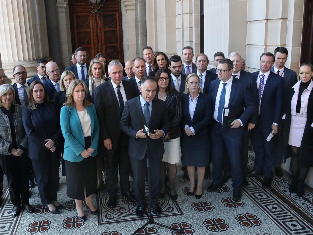 John Pesutto and members of the opposition in front of parliament after their protest walk-out. Picture: David Crosling