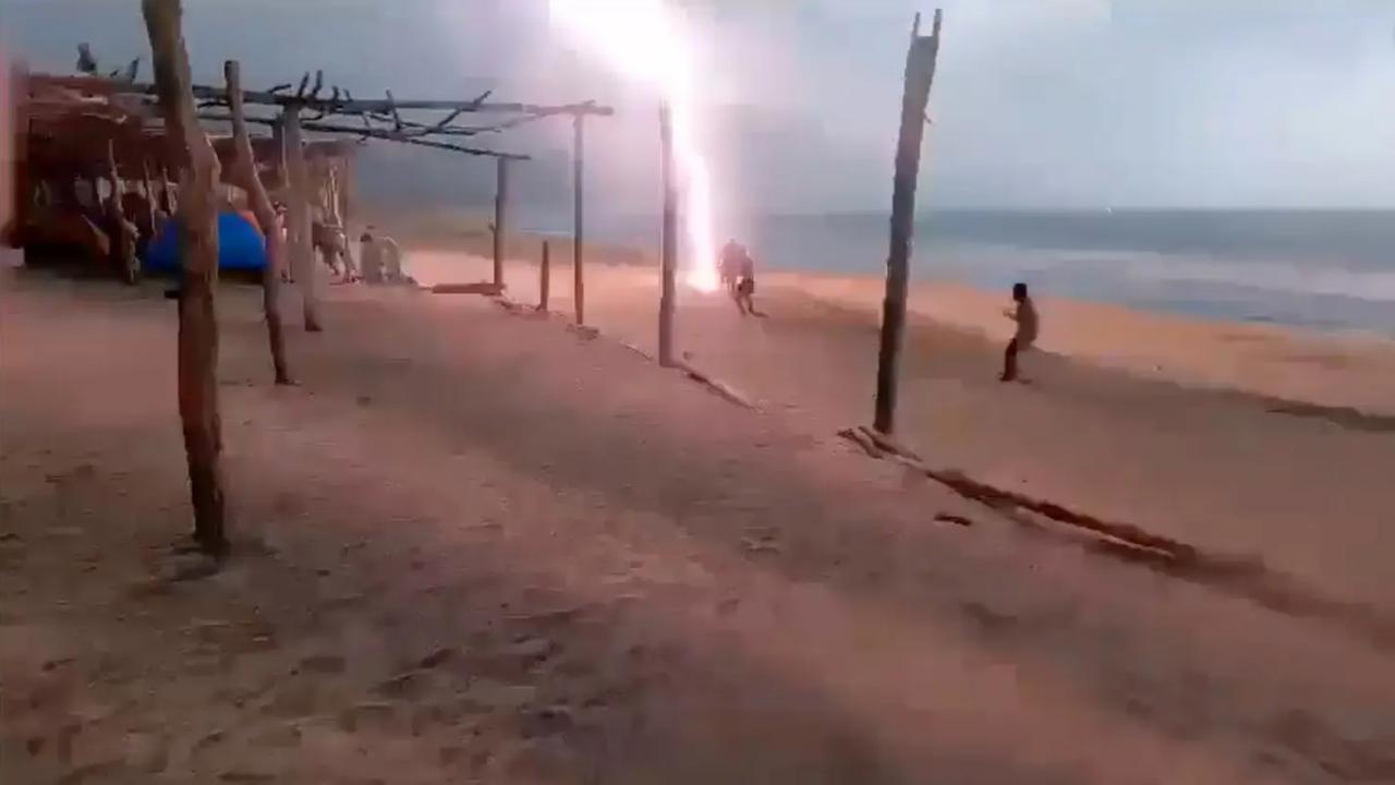Harrowing video footage captured the moment a lightning bolt hit the beach and travelled across the sand. Picture: Angel Rock-lover Pakito/Facebook