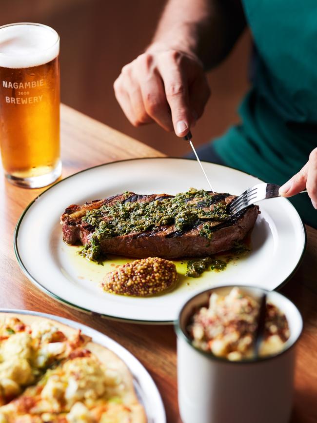 Raising the steaks: NY striploin with a side of mac and cheese. Picture: Gareth Sobey.