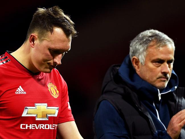 MANCHESTER, ENGLAND - SEPTEMBER 25:  Jose Mourinho, Manager of Manchester United applauds fans as Phil Jones of Manchester United looks dejected after missing his team's eighth penalty, meaning Derby County win the match on penalties during the Carabao Cup Third Round match between Manchester United and Derby County at Old Trafford on September 25, 2018 in Manchester, England.  (Photo by Gareth Copley/Getty Images)