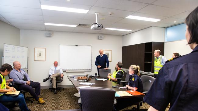 A meeting of agency staff involved in the raids.