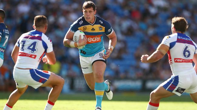 GOLD COAST, AUSTRALIA - APRIL 10: Jarrod Wallace of the Titans runs the ball during the round five NRL match between the Gold Coast Titans and the Newcastle Knights at Cbus Super Stadium, on April 10, 2021, in Gold Coast, Australia. (Photo by Chris Hyde/Getty Images)