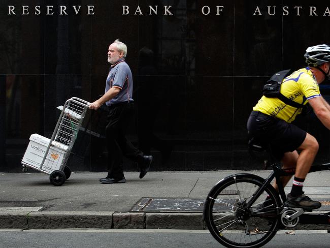 Pedestrians pass the Reserve Bank of Australia (RBA) headquarters. Picture: Lisa Maree Williams