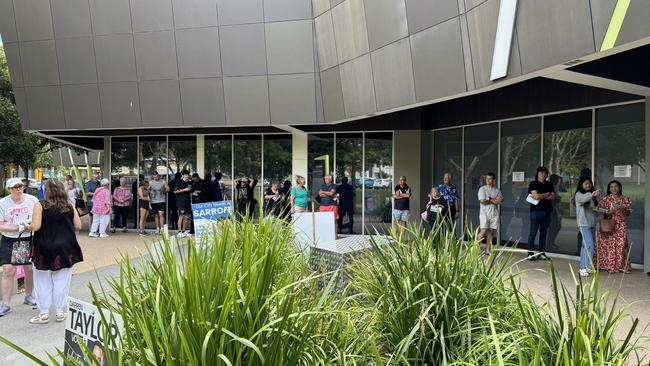 Large lines of voters already lined up before polls opened at Southport Community Centre on Lawson Street, Gold Coast. Picture: Andrew Potts