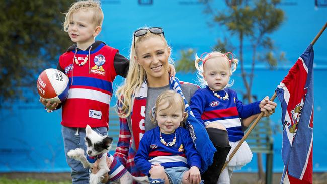 Liam Picken's partner Annie Nolan and the couple's children Malachy, 4, and 2-year-old twins Delphi and Cheska, with their dog Tofu. Picture: Nathan Dyer