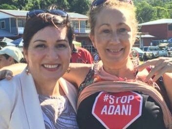 Environment Minister Leeanne Enoch with an Adani portester in Cairns