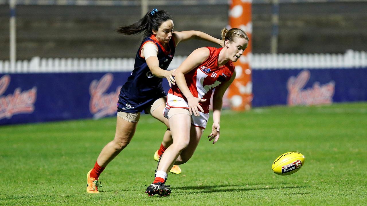 North Adelaide's Brittany Perry battles Norwood's Cassandra Tsoumbris for the ball during the sides' SANFLW preliminary final at Norwood Oval. Picture: Deb Curtis