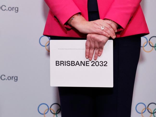 TOPSHOT - Queensland Premier Annastacia Palaszczuk holds the queue card after Brisbane was announced as the 2032 Summer Olympics host city during the 138th IOC Session at Hotel Okura in Tokyo on July 21, 2021. (Photo by Toru Hanai / POOL / AFP)