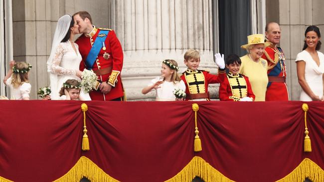 Newlyweds Prince William Kate Middleton share a kiss on the balcony at Buckingham Palace on April 29, 2011. Picture: Getty Images.