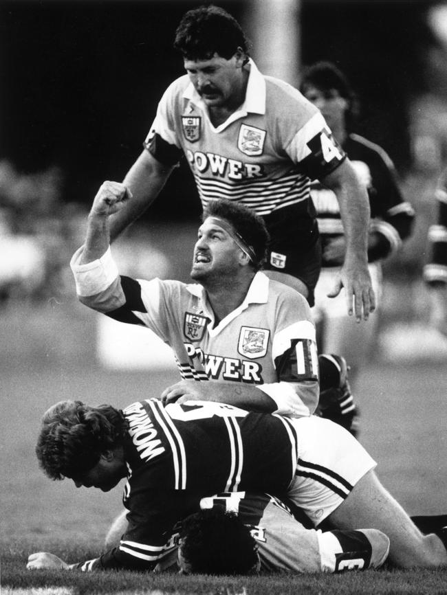 Greg Dowling celebrates Brisbane’s first try.