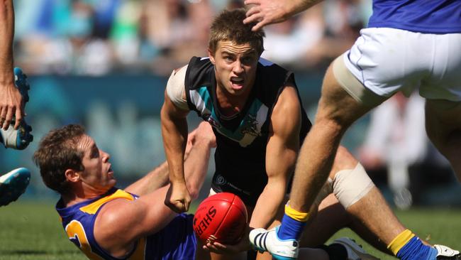 Port Adelaide’s Jarrad Irons gets a handpass away.