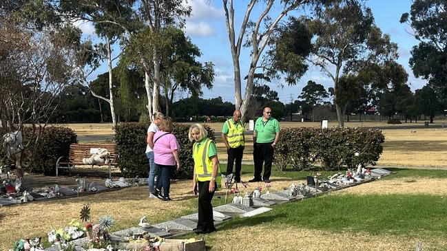 Memorial park staff were seen inspecting the site on Friday morning, where 80 plaques were stolen. Photo: Nilsson Jones.