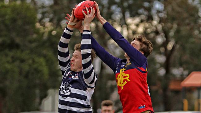 RDFL Diggers Rest v Macedon. Tom Hildebrand Macedon marks in front of Deven Costigan Diggers Rest. Picture: Aaron Cook