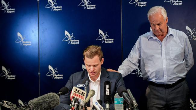 Disgraced Australian Cricket Captain Steve Smith (left) reacts alongside his father Peter Smith.