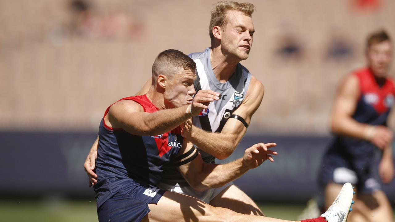 Jack Watts and former teammate Jake Melksham clash at the MCG in 2019.