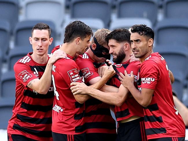 SYDNEY, AUSTRALIA - DECEMBER 22: Zachary Sapsford of the Wanderers celebrates scoring a goal with team mates during the round nine A-League Men match between Western Sydney Wanderers and Wellington Phoenix at CommBank Stadium, on December 22, 2024, in Sydney, Australia. (Photo by Brendon Thorne/Getty Images)