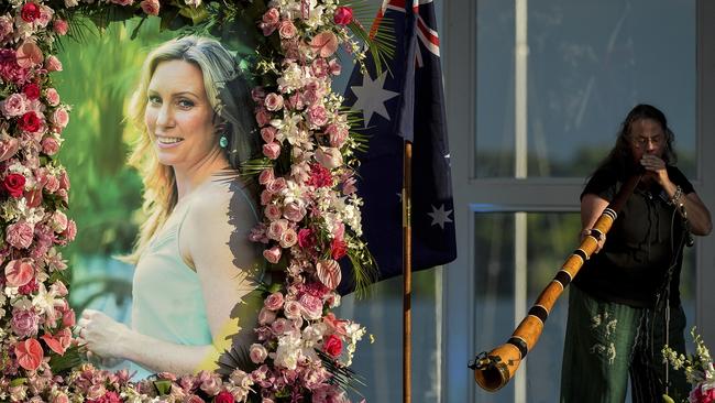 Johanna Morrow plays the didgeridoo during a memorial service for Justine Ruszczyk Damond at Lake Harriet in Minneapolis. Picture: AP