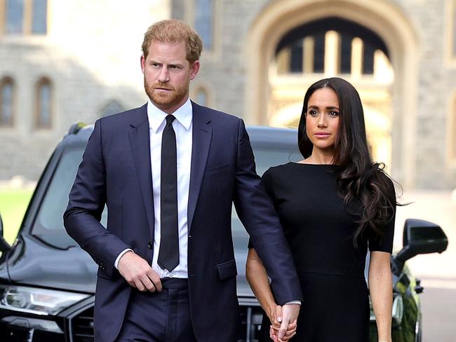 WINDSOR, ENGLAND - SEPTEMBER 10: Prince Harry, Duke of Sussex, and Meghan, Duchess of Sussex on the long Walk at Windsor Castle arrive to view flowers and tributes to HM Queen Elizabeth on September 10, 2022 in Windsor, England. Crowds have gathered and tributes left at the gates of Windsor Castle to Queen Elizabeth II, who died at Balmoral Castle on 8 September, 2022. (Photo by Chris Jackson/Getty Images)