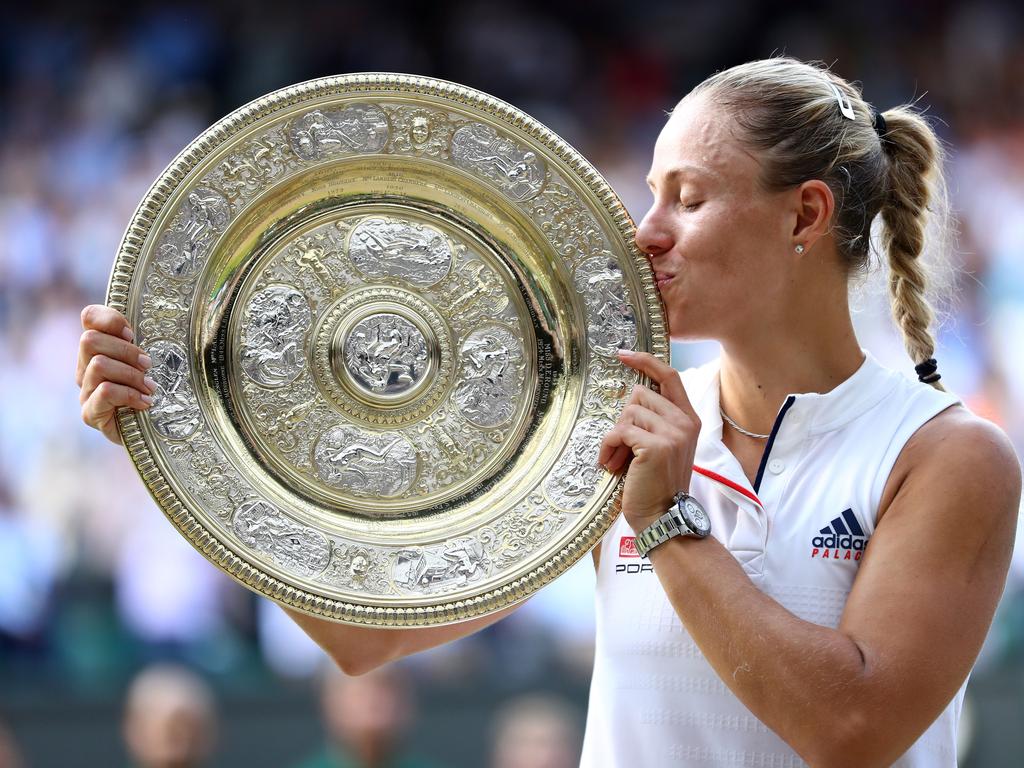 Angelique Kerber of Germany kisses the Venus Rosewater Dish as she poses for photographs after defeating Serena Williams of The United States in the Ladies' Singles final on day twelve of the Wimbledon Lawn Tennis Championships at All England Lawn Tennis and Croquet Club on July 14, 2018 in London, England. (Photo by Michael Steele/Getty Images)