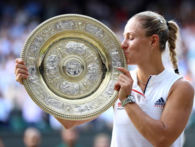 Angelique Kerber of Germany kisses the Venus Rosewater Dish as she poses for photographs after defeating Serena Williams of The United States in the Ladies' Singles final on day twelve of the Wimbledon Lawn Tennis Championships at All England Lawn Tennis and Croquet Club on July 14, 2018 in London, England. (Photo by Michael Steele/Getty Images)