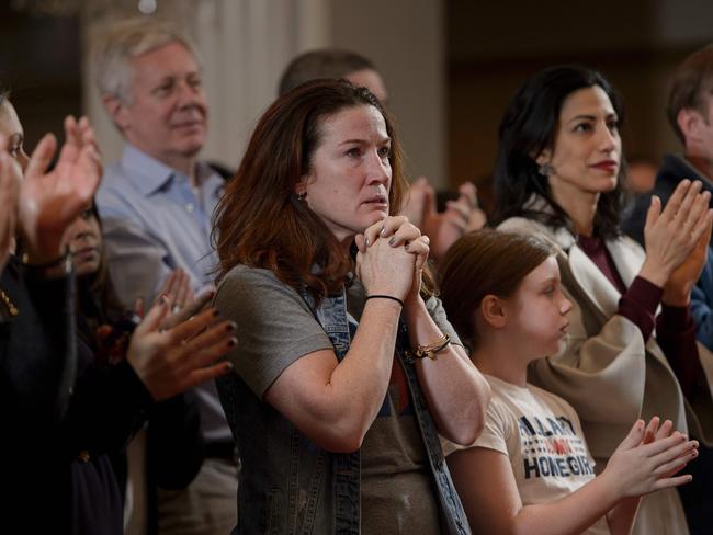 Clinton aide Huma Abedin (right) along with emotional staff as they wait for Hillary Clinton to appear. Picture: AFP PHOTO / Brendan Smialowski