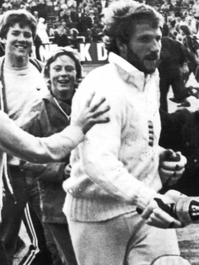 Ian Botham is congratulated by fans as he leaves the field at Headingley after scoring a century on day four of the third Test in 1981