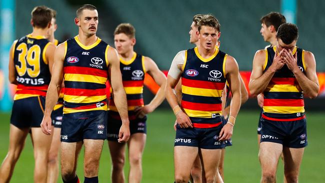 Taylor Walker, Matt Crouch and Brad Crouch walk off Adelaide Oval after the Crows’ loss to St Kilda on July 20. Picture: Daniel Kalisz/Getty