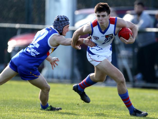 Tom Graham shrugs a tackle. Picture: Stuart Milligan