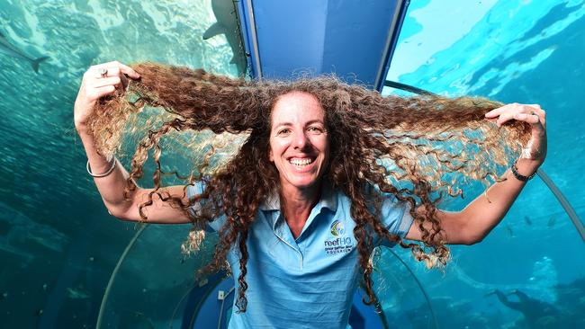 Kirstin Dobbs, Director Reef HQ, has been growing her hair for 25 years and will shave it off in support of her husband, friends and colleges who have been affected by cancer. Picture: Shae Beplate.