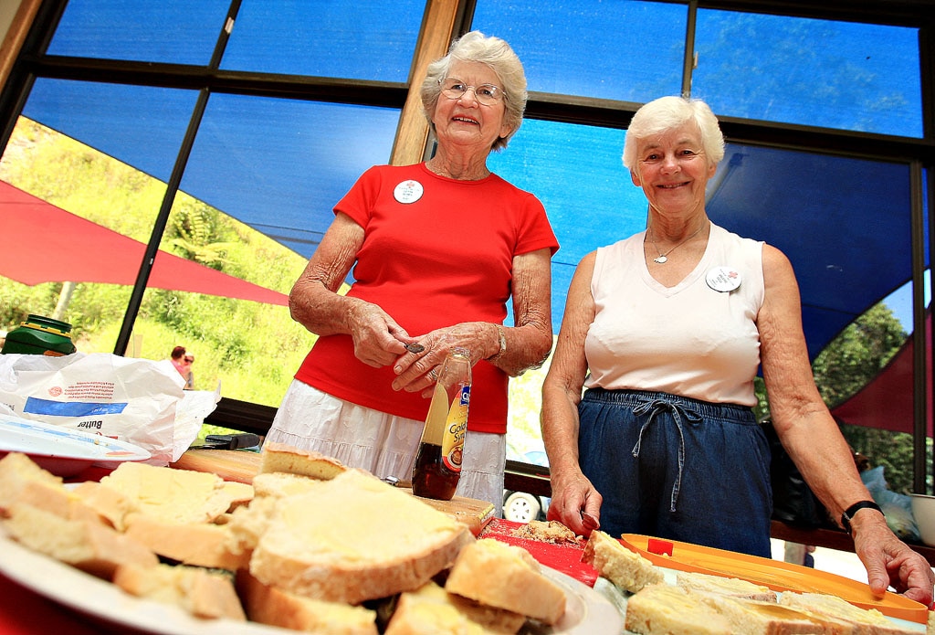 Betty Brims and Valerie Bell making damper and taking donations for the Hati Earthquake for the Red Cross. Picture: Blainey Woodham