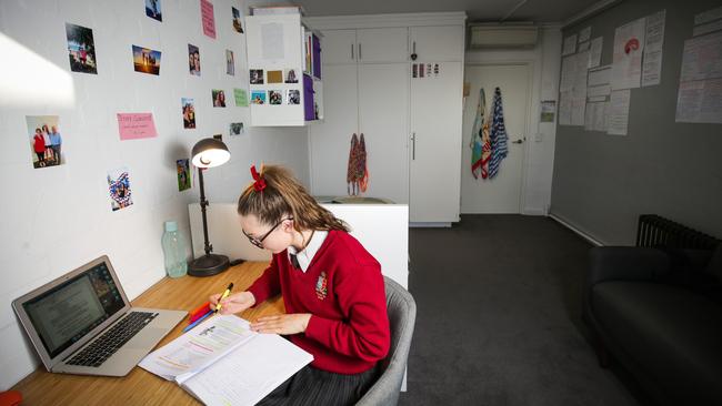 Olivia King has decorated her room with photos of her family. Picture: Nicole Cleary