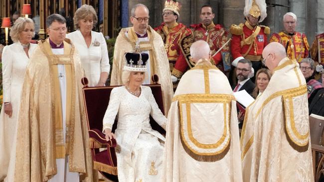 Queen Camilla sits on the throne wearing a modified version of Queen Mary's Crown. Picture: AFP